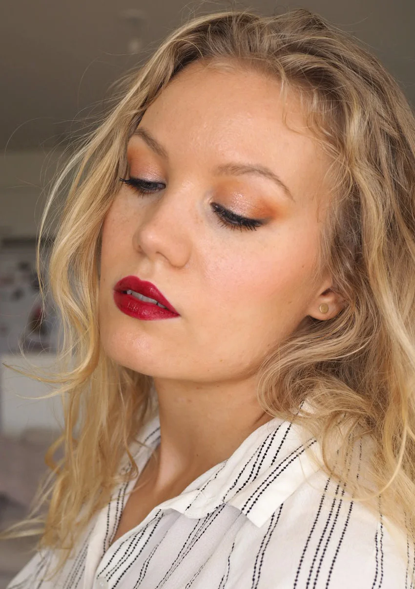 makeup black pencil on the eyes with dark lips