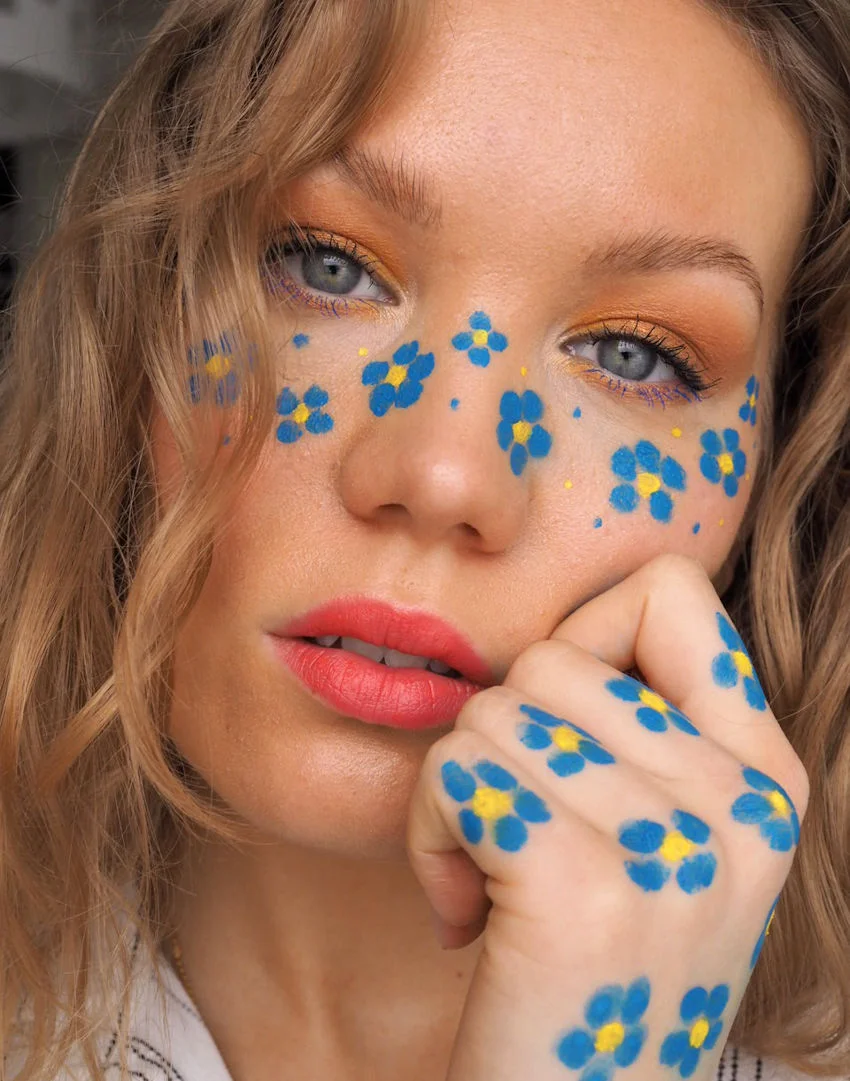 blue flower freckles makeup look