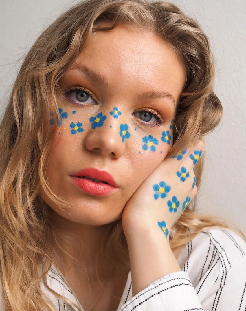 makeup blue flower freckles